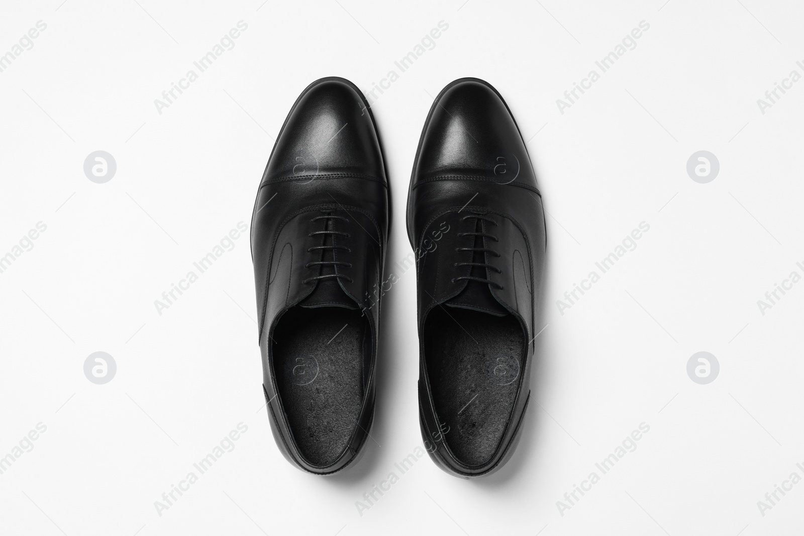 Photo of Pair of leather men shoes on white background, top view