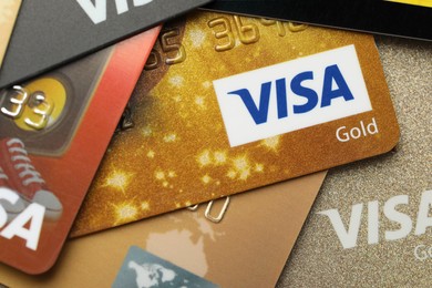 MYKOLAIV, UKRAINE - FEBRUARY 23, 2022: Bank cards of Visa payment system, closeup