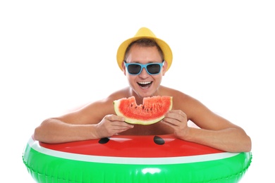 Photo of Shirtless man with inflatable ring and watermelon on white background