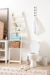 Interior of stylish bathroom with toilet bowl