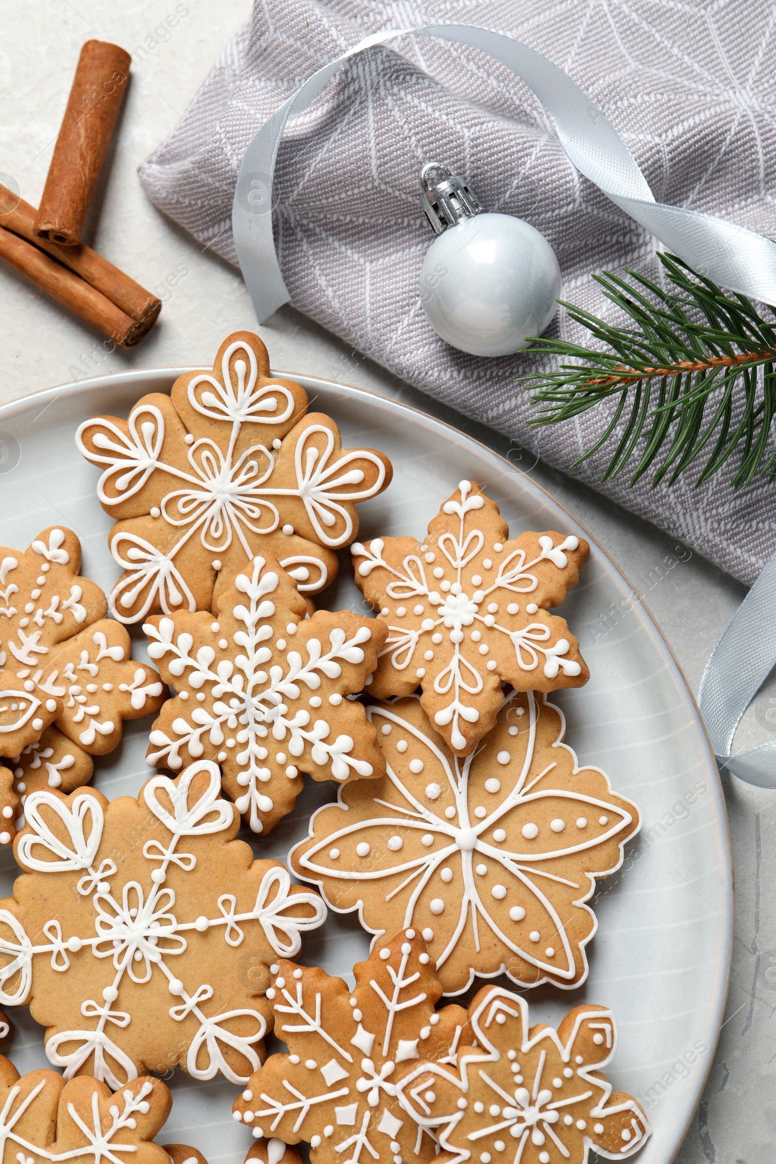 Photo of Tasty Christmas cookies and festive decor on table, flat lay