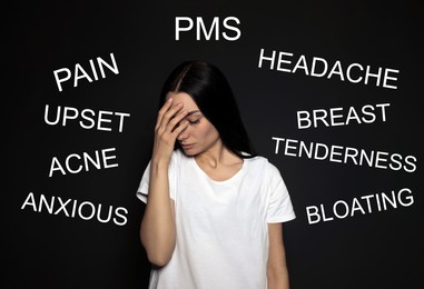 Image of Hormones imbalance. Upset young woman and different words on black background
