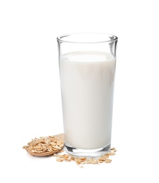 Glass with oat milk and flakes on white background
