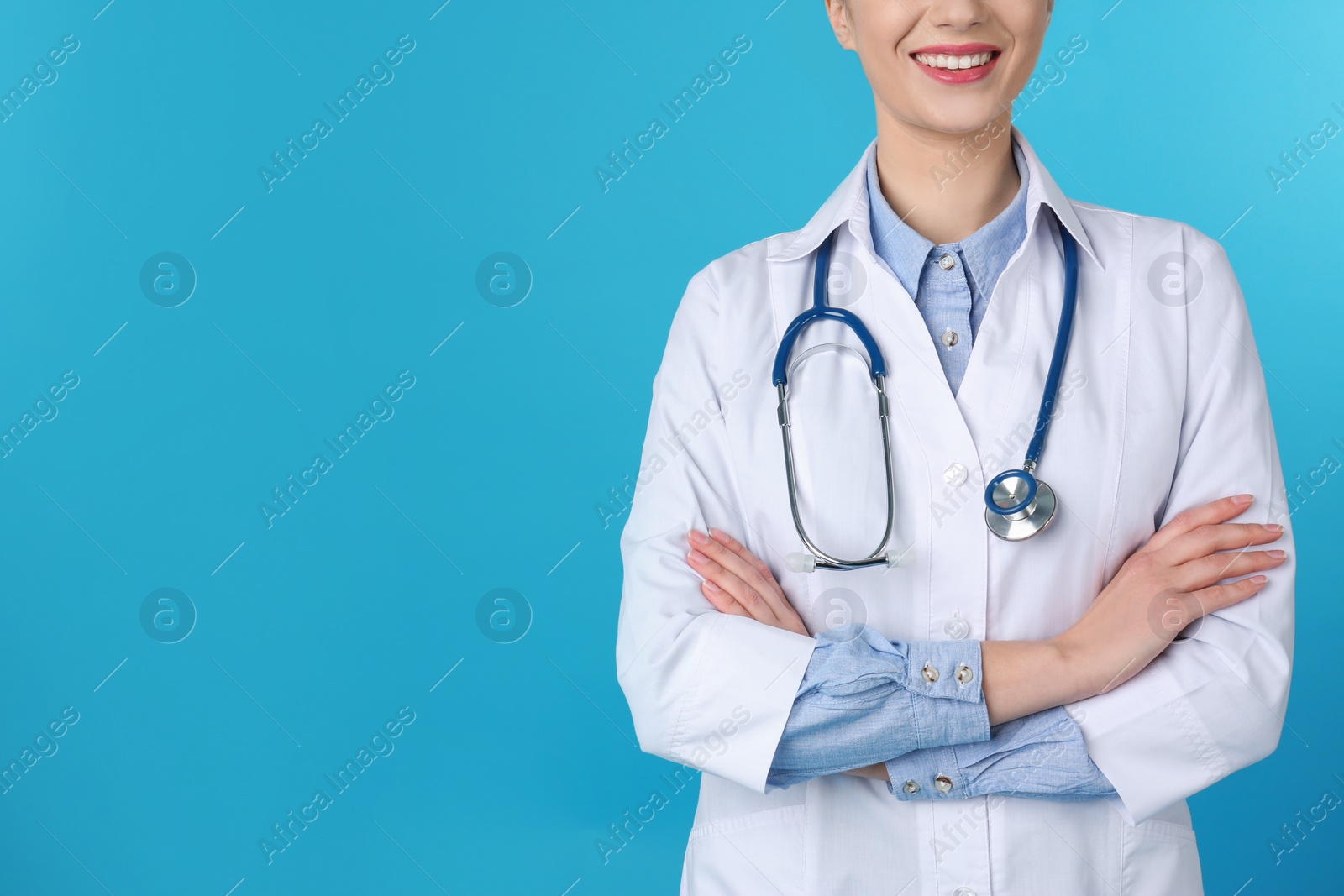 Photo of Young medical student in uniform on color background, closeup. Space for text