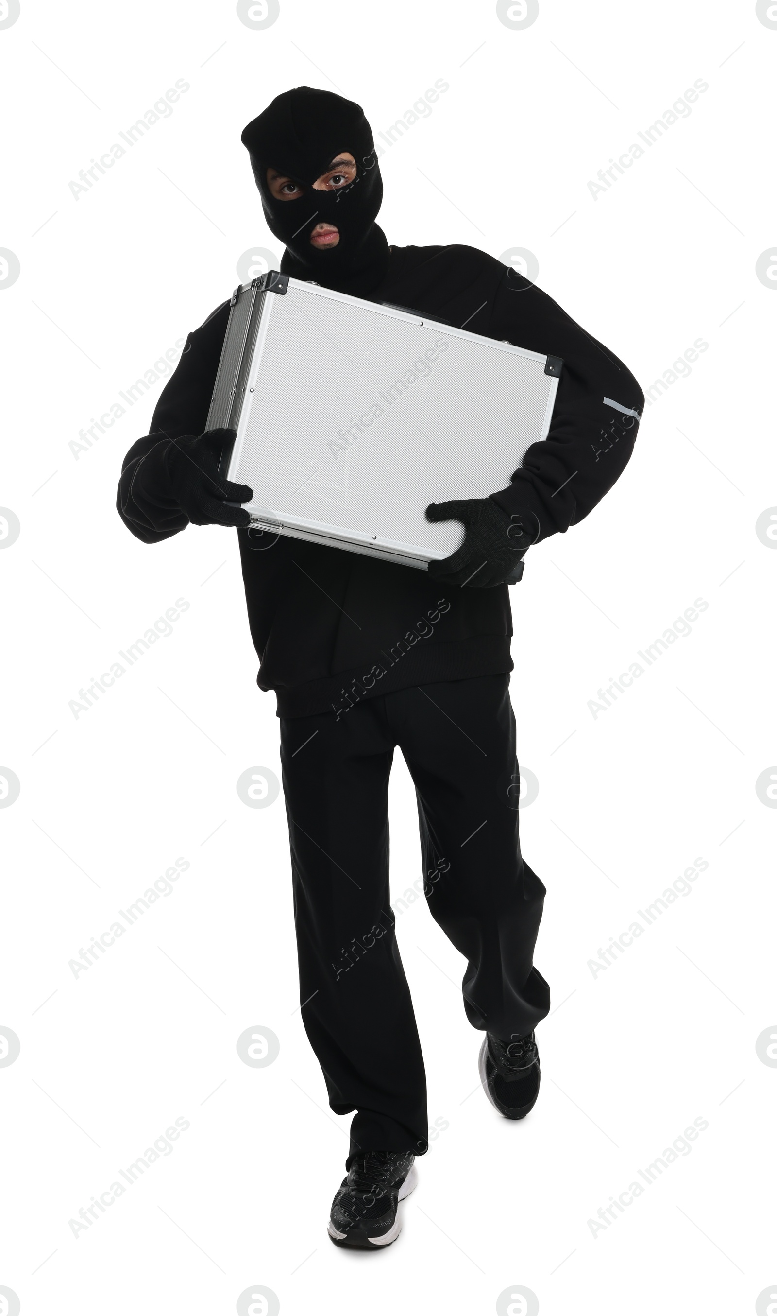 Photo of Thief in balaclava running with briefcase of money on white background