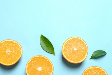 Photo of Flat lay composition with ripe oranges and space for text on color background