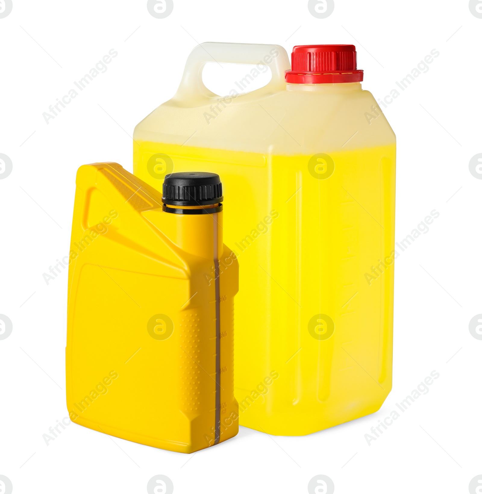 Photo of Yellow canisters with liquids on white background