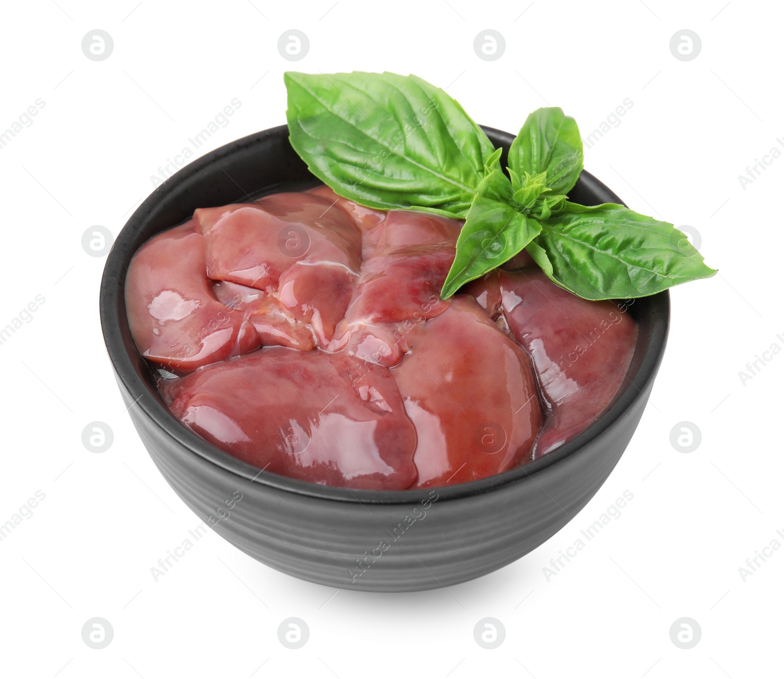 Photo of Bowl of raw chicken liver with basil isolated on white
