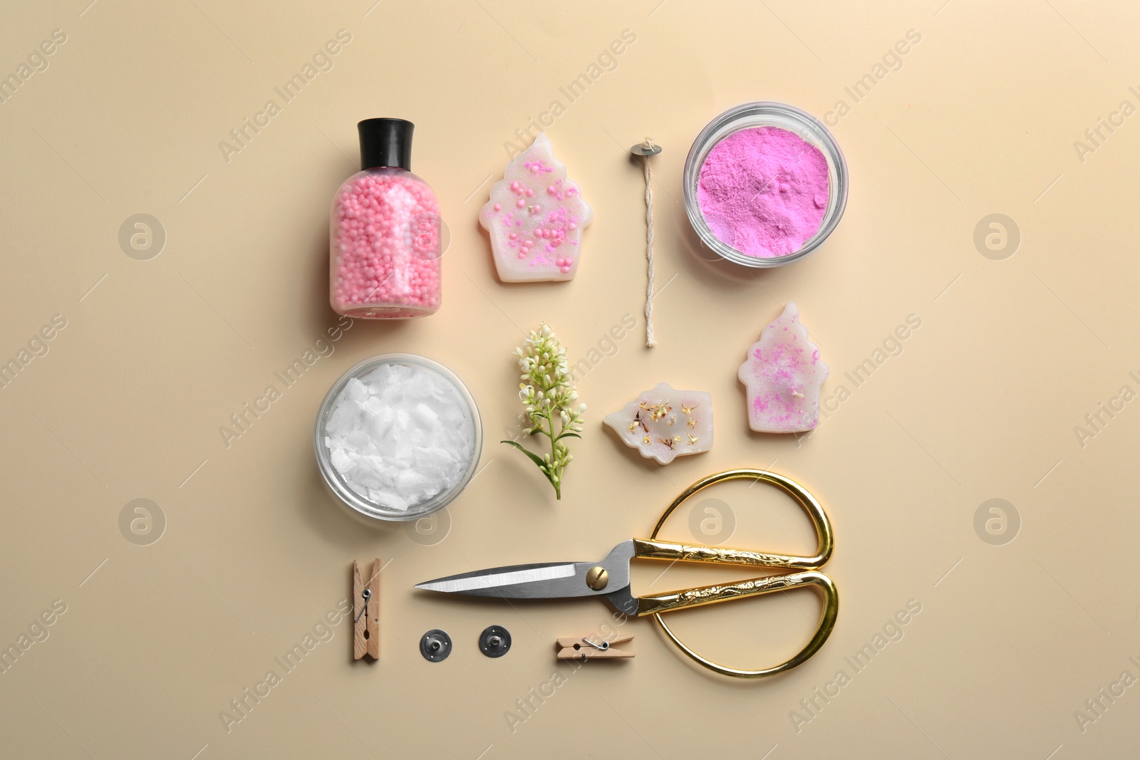 Photo of Flat lay composition with handmade candles and tools on color background