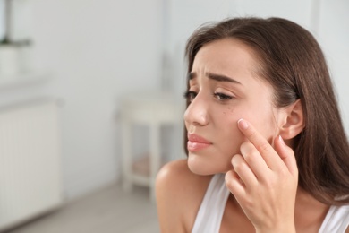 Photo of Young woman with eyelash loss problem indoors