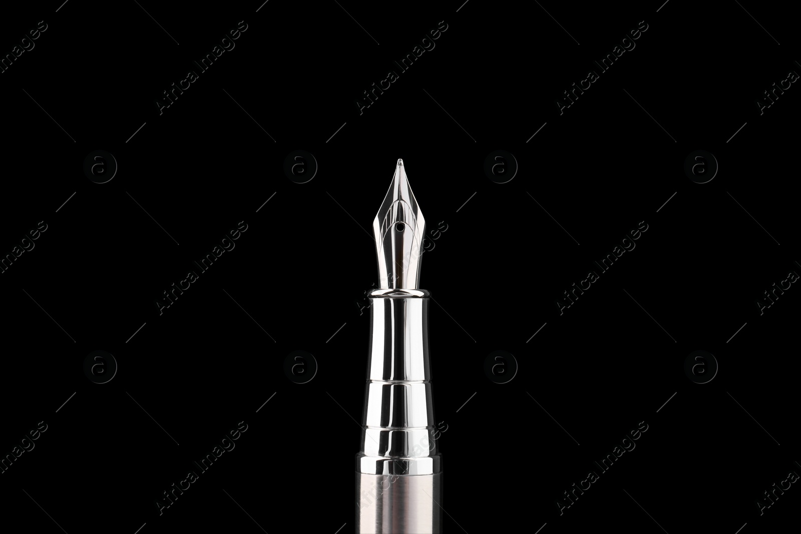 Photo of Stylish silver fountain pen on black background