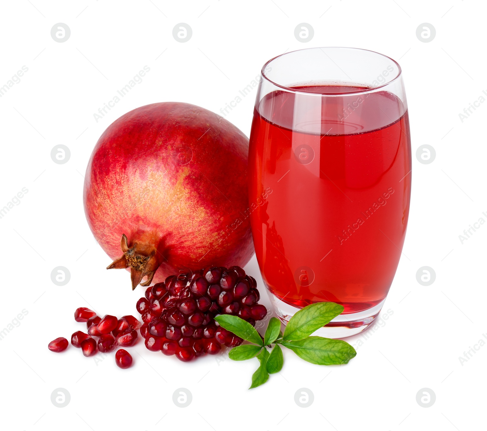 Photo of Refreshing pomegranate juice in glass, leaves, seeds and fruit isolated on white
