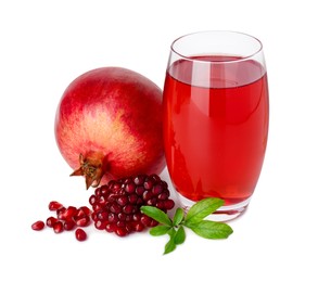 Photo of Refreshing pomegranate juice in glass, leaves, seeds and fruit isolated on white