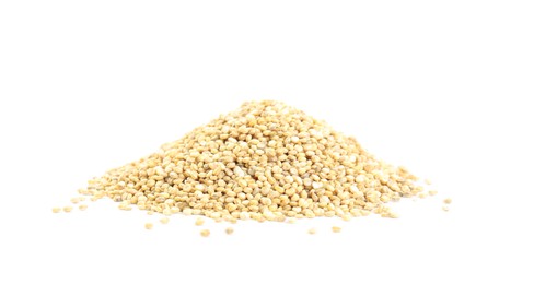 Photo of Pile of raw quinoa on white background