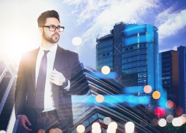 Double exposure of businessman and different buildings in city