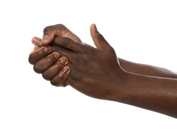 African-American man showing hand gesture on white background, closeup