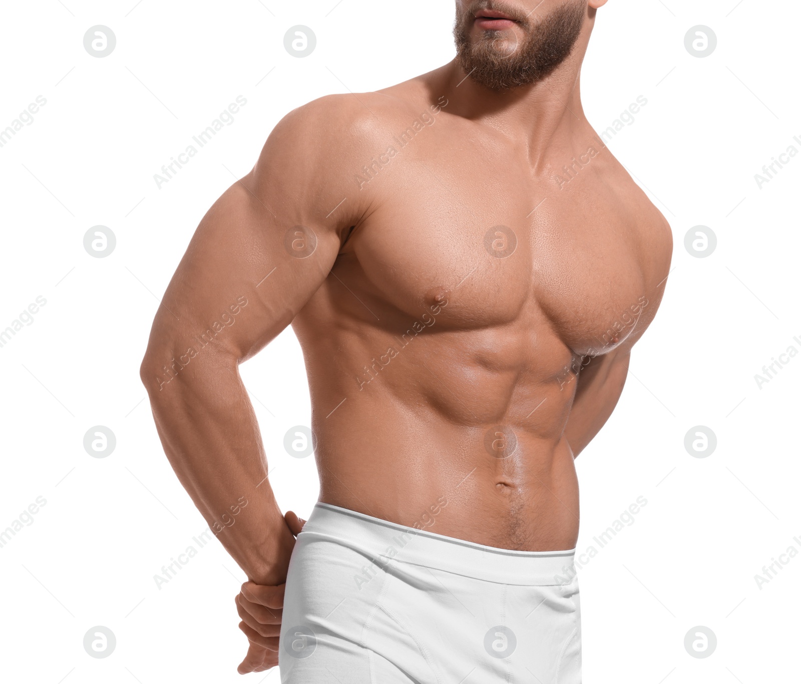 Photo of Muscular man showing abs isolated on white, closeup. Sexy body