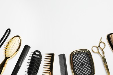 Hairdressing tools on white background, flat lay. Space for text