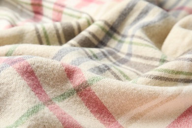 Photo of Soft crumpled checkered plaid as background, closeup