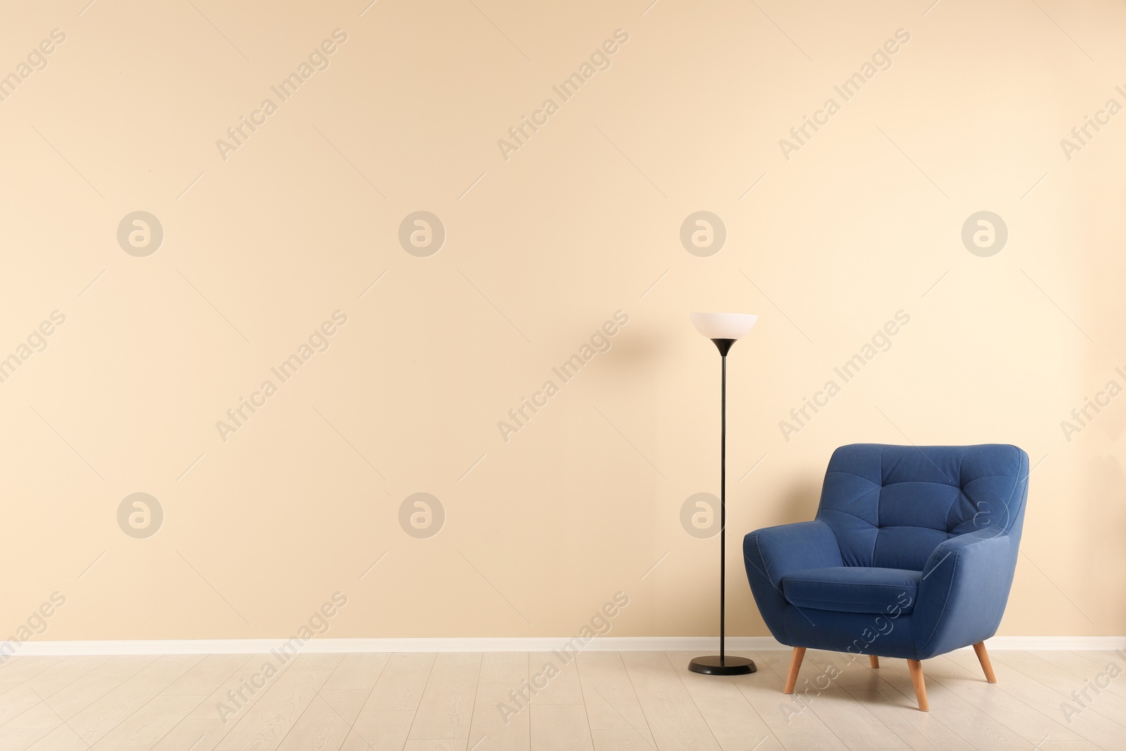 Photo of Stylish living room interior with comfortable armchair and space for text