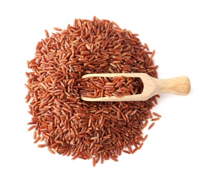 Photo of Scoop and uncooked brown rice on white background, top view