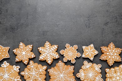 Photo of Tasty Christmas cookies on grey table, flat lay. Space for text