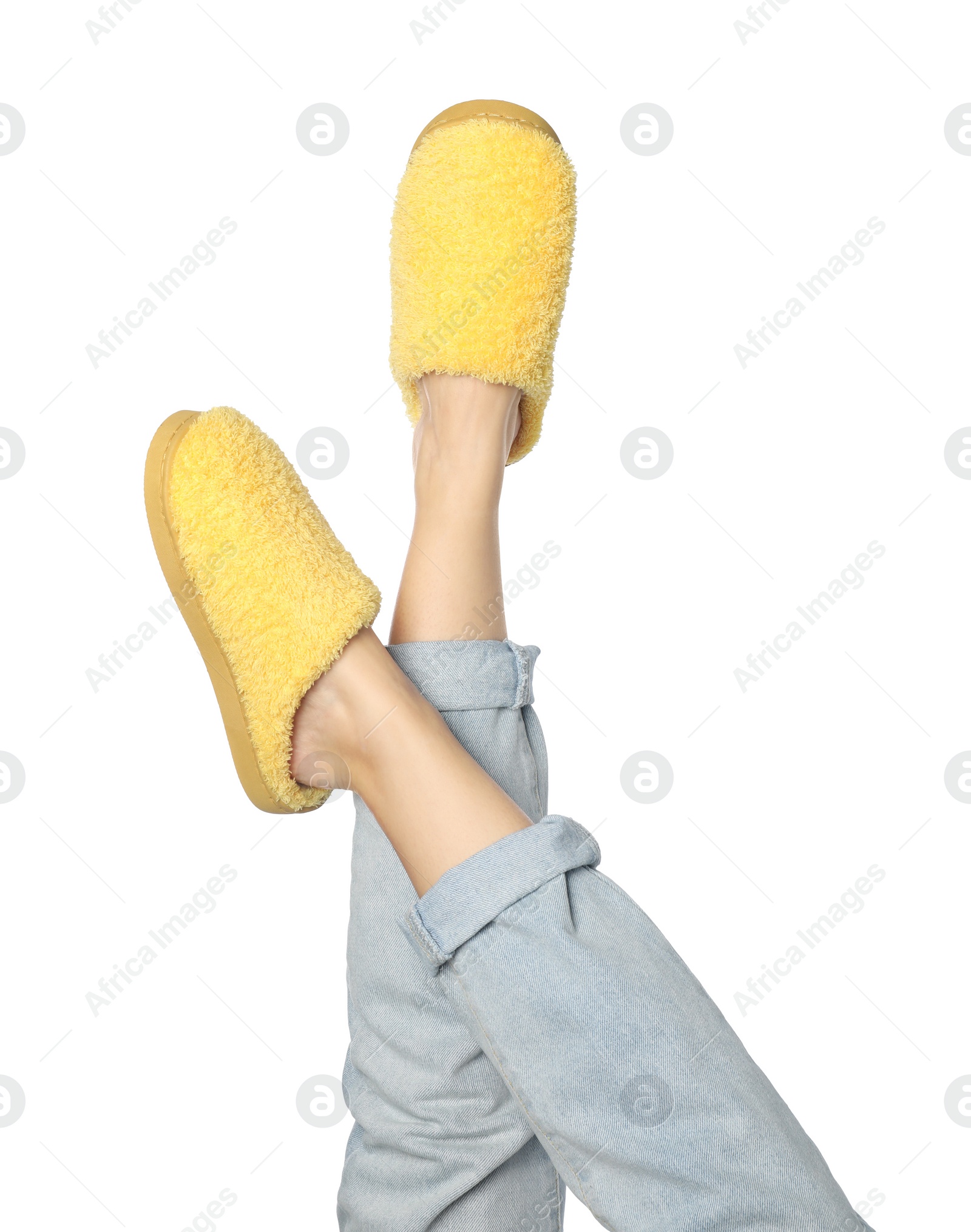 Photo of Woman in yellow soft slippers on white background, closeup