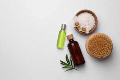 Flat lay composition with different spa products on white background. Space for text