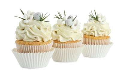 Photo of Tasty Easter cupcakes with vanilla cream isolated on white