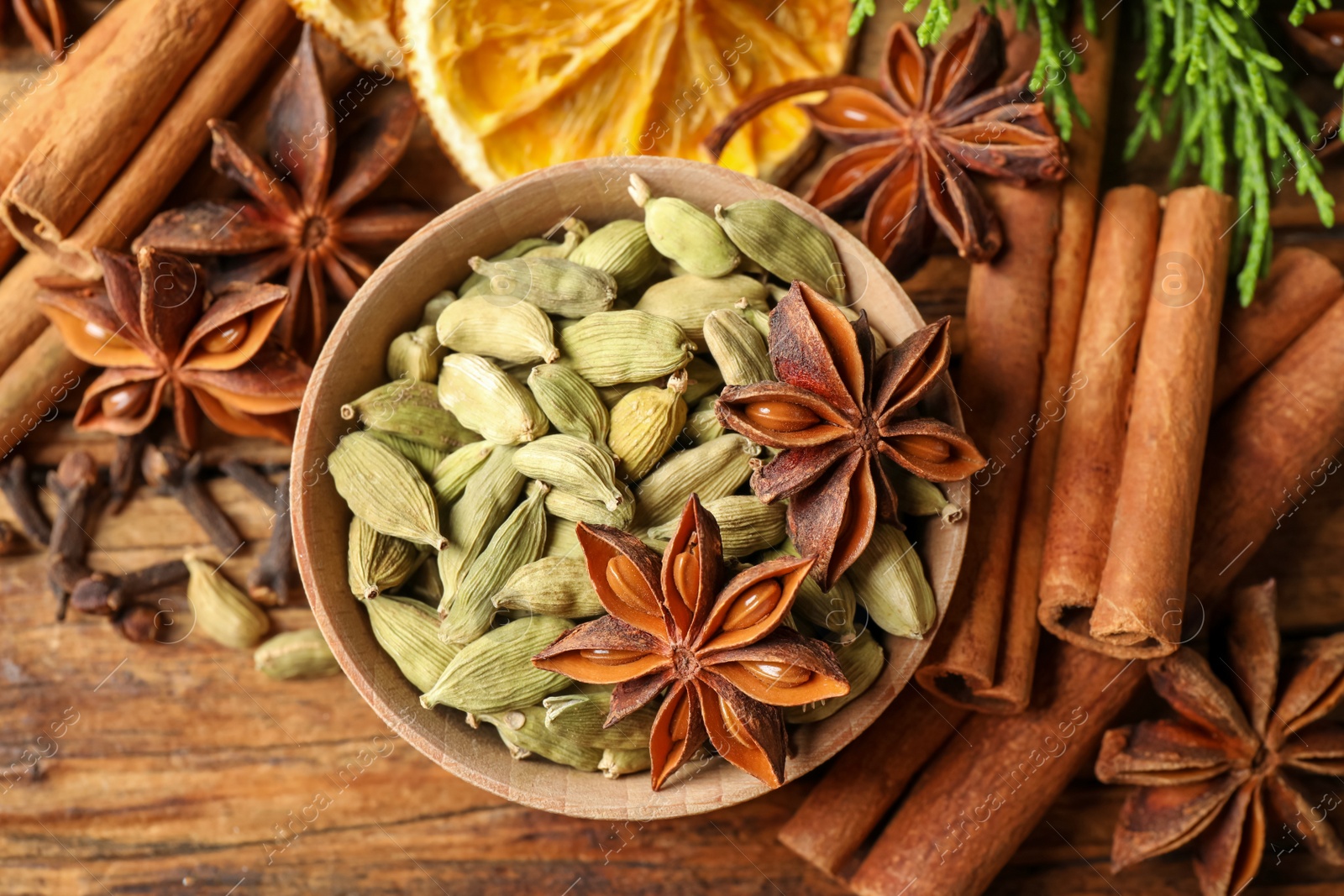 Photo of Flat lay composition with mulled wine ingredients on wooden table