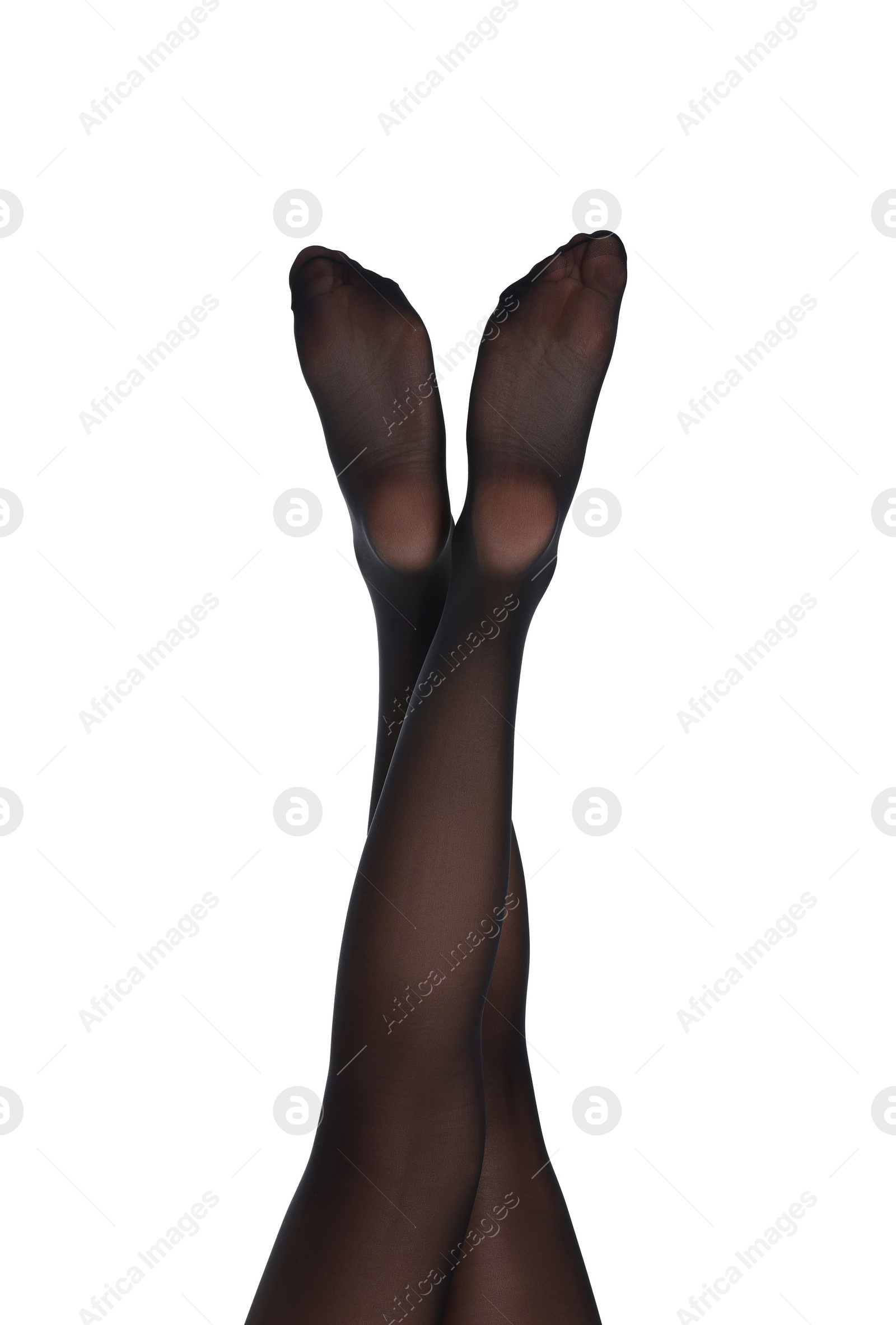 Photo of Woman with beautiful long legs wearing black tights on white background, closeup