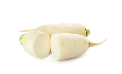 Sliced and whole fresh ripe turnips on white background