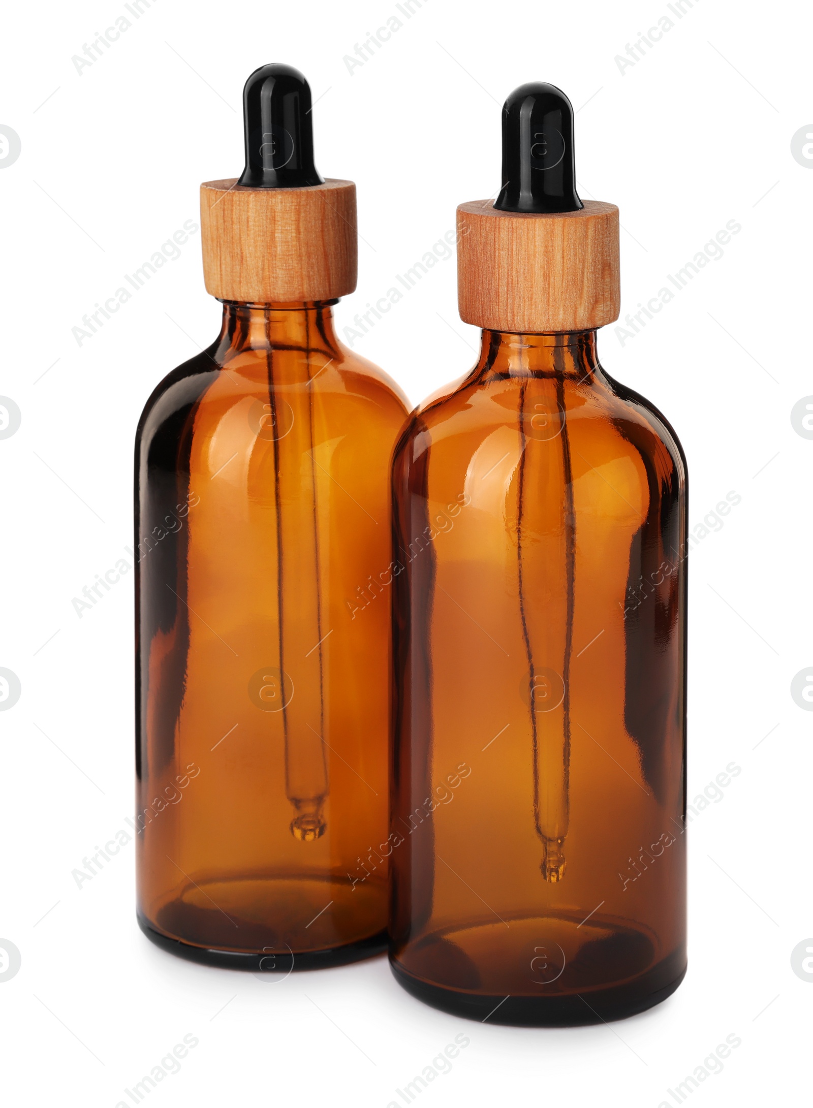 Photo of New empty glass bottles with droppers isolated on white