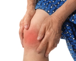 Senior woman having knee problems on white background, closeup