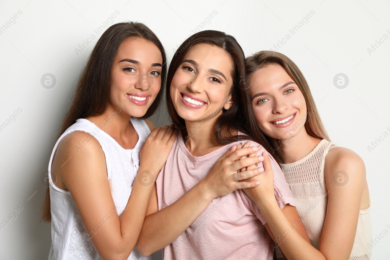 Photo of Happy women on white background. Girl power concept