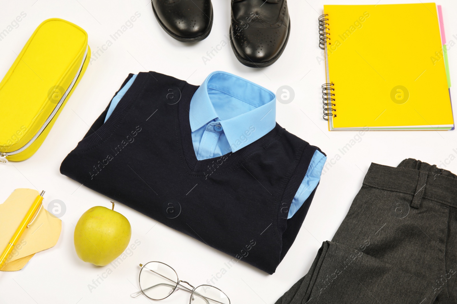 Photo of Composition with school uniform for boy on white background