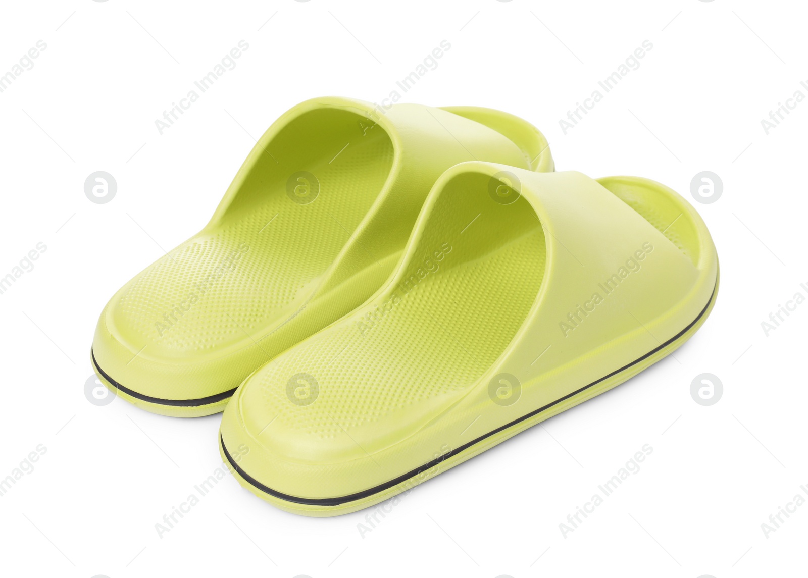 Photo of Pair of green rubber slippers isolated on white