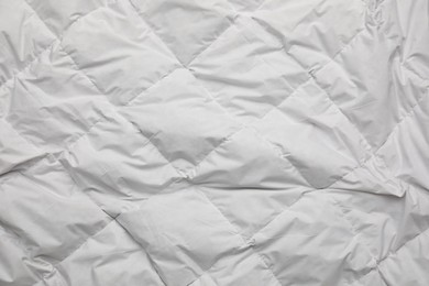 Photo of Soft crumpled blanket as background, top view