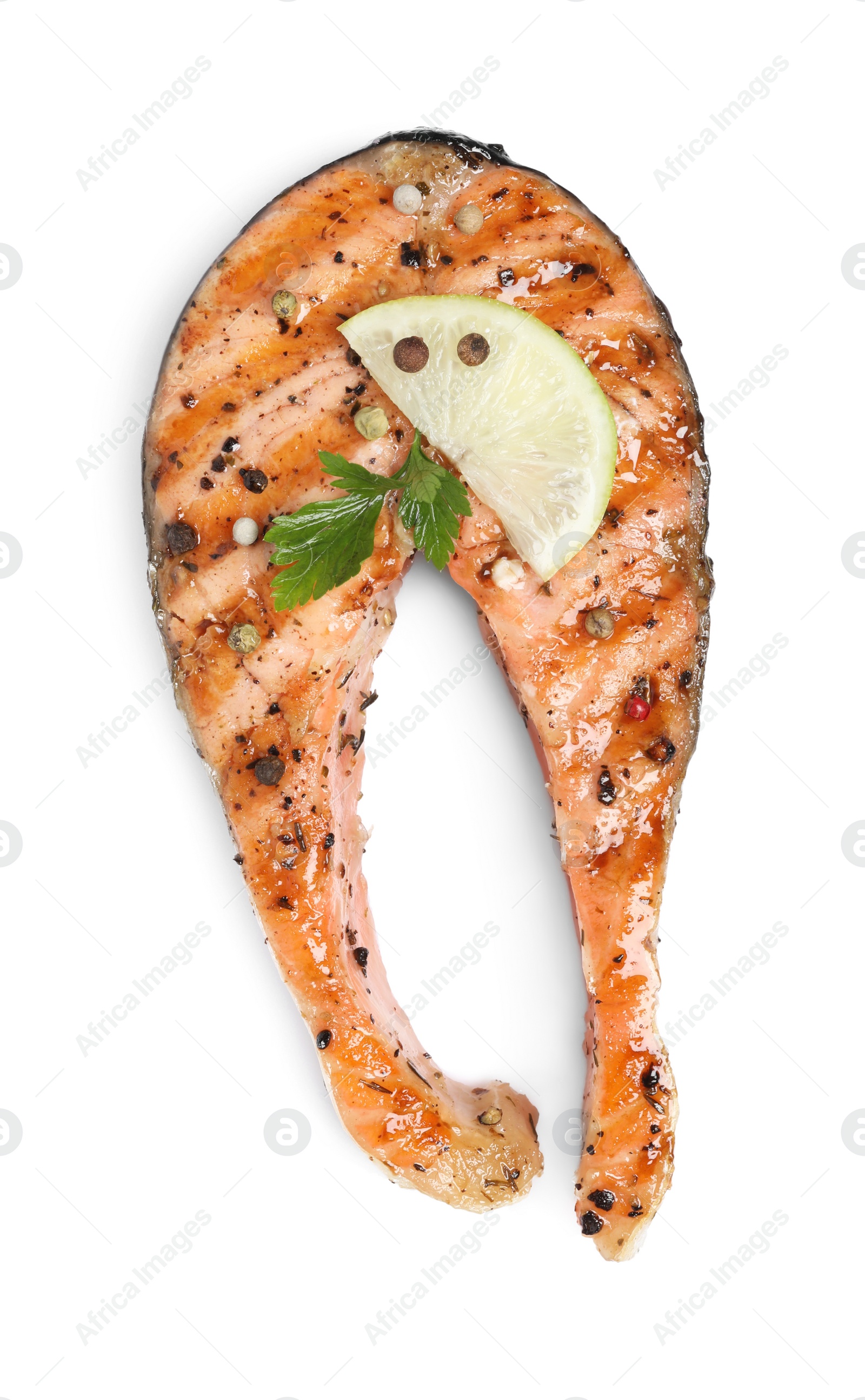 Photo of Tasty salmon steak with lemon, peppercorns and parsley isolated on white, top view