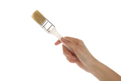 Photo of Woman holding paint brush on white background, closeup