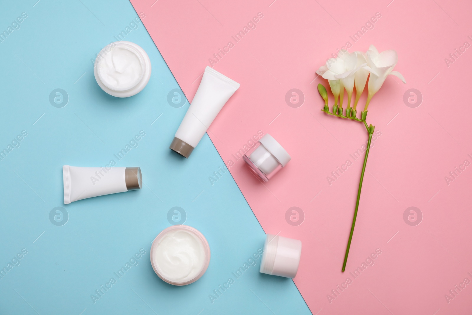 Photo of Flat lay composition with cosmetic products on color background