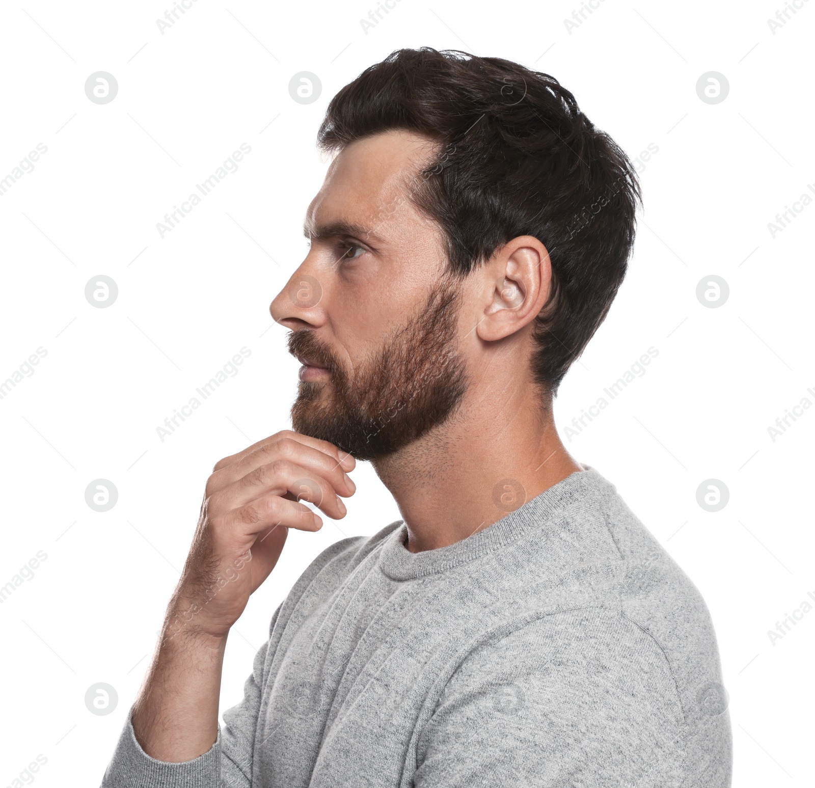 Photo of Profile portrait of bearded man on white background