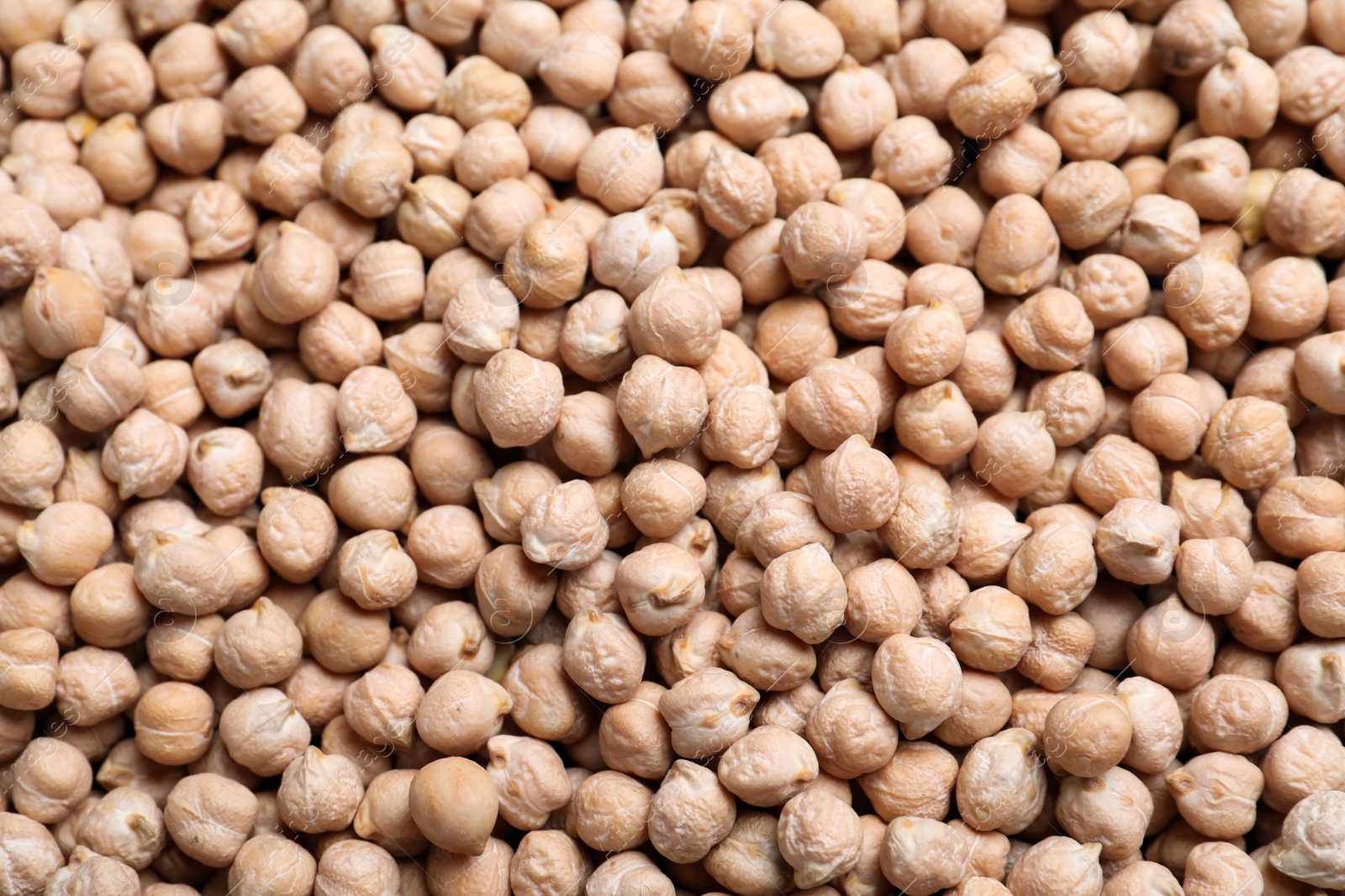 Photo of Many chickpeas as background, top view. Natural food