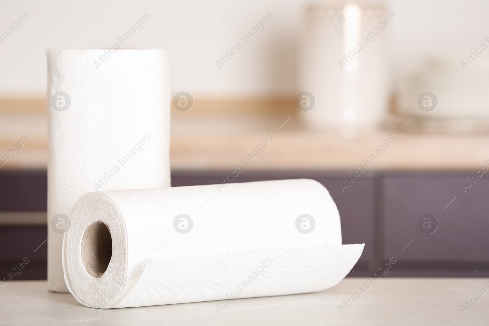 Photo of Rolls of paper towels on table in kitchen