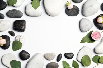 Photo of Flat lay composition with spa stones and space for text on white background