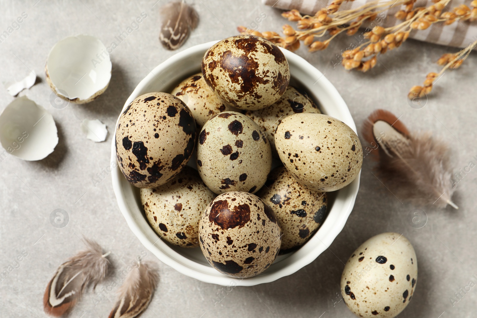 Photo of Flat lay composition with quail eggs on light grey table