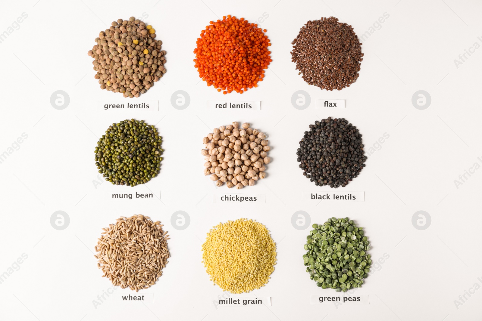 Photo of Different types of legumes and cereals on white background, top view. Organic grains