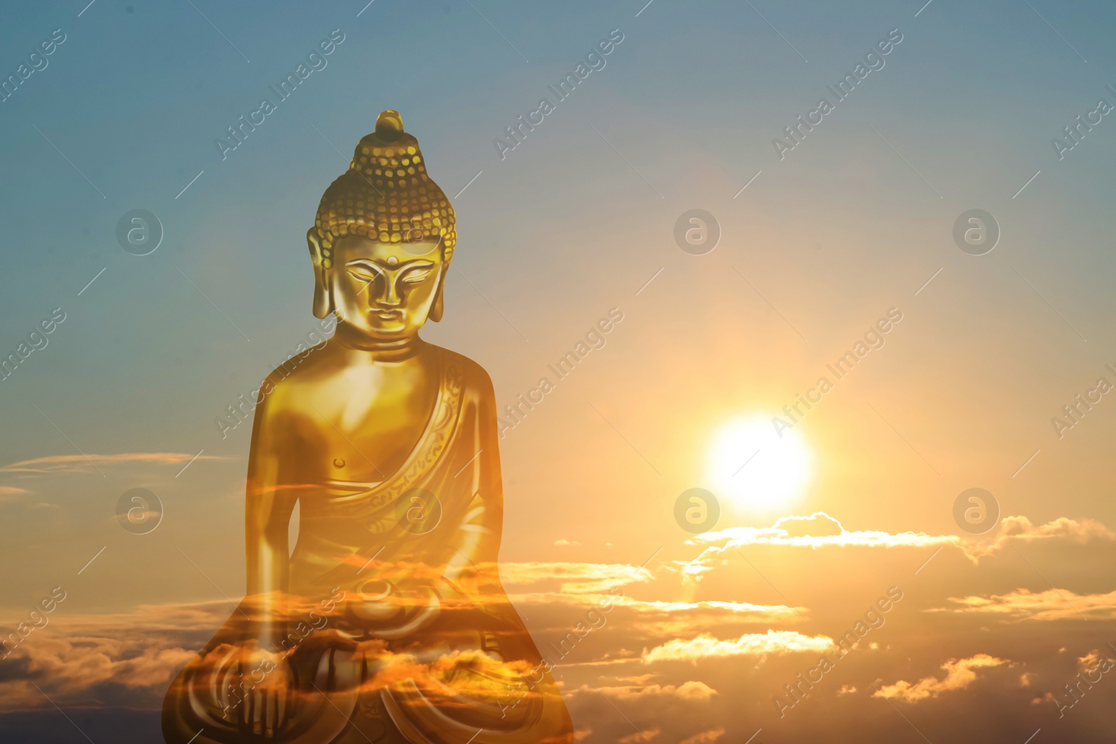 Image of Golden Buddha sculpture and beautfiful sky at sunset on background