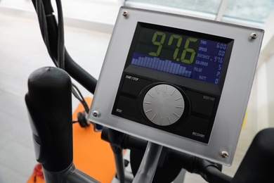 Control panel of modern elliptical machine cross trainer indoors