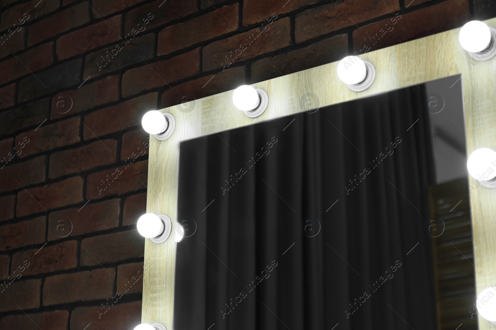 Photo of Mirror with light bulbs in makeup room